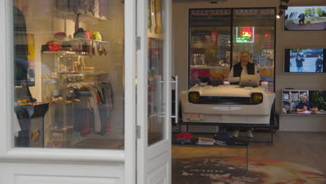 Fashion-Store-With-Sales-Counter-Made-From-Old-Car-On-Camden-High-Street-In-North-London-UK